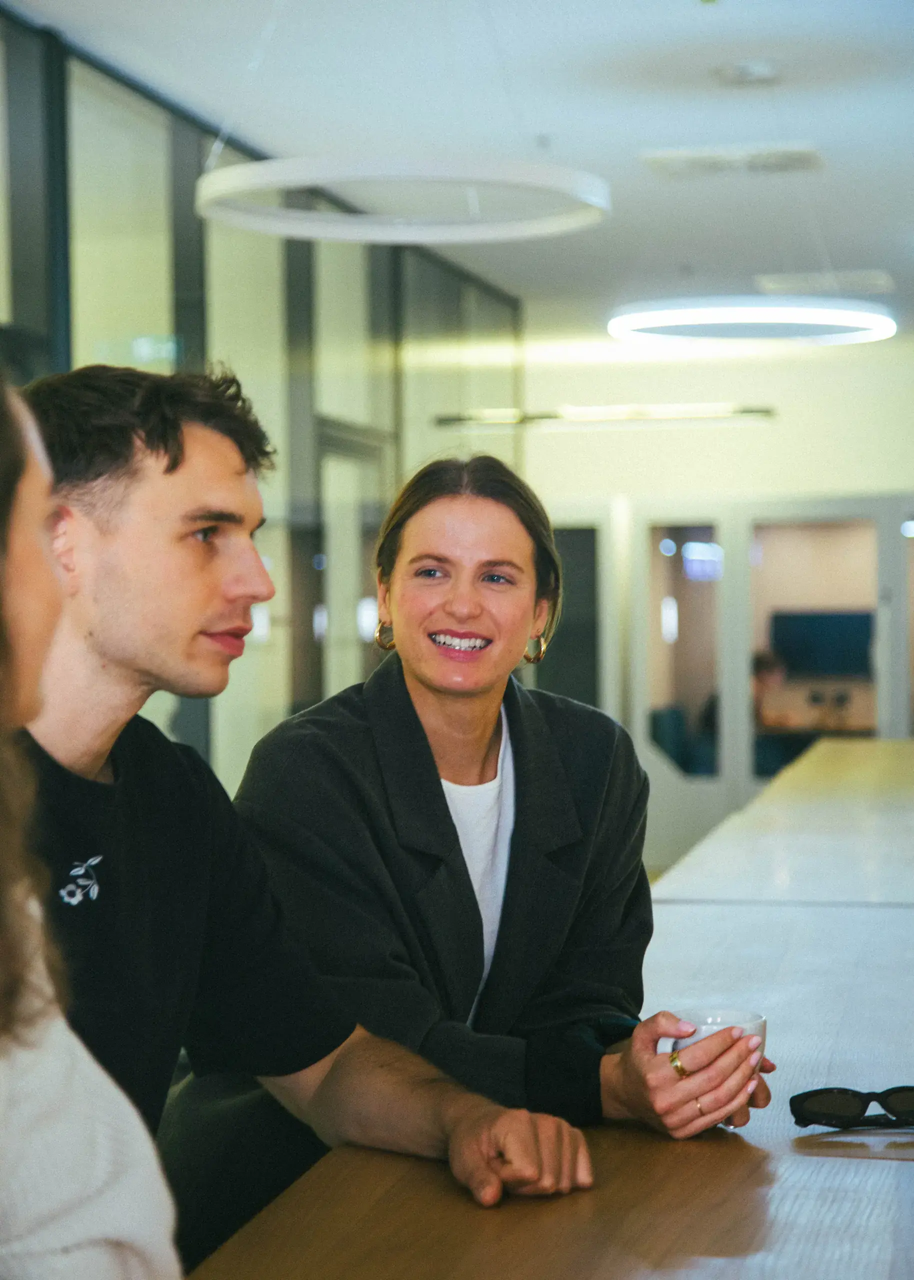 Colleagues chatting over coffee in the FINN office